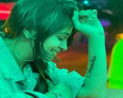 She has also engraved a tattoo of writing 